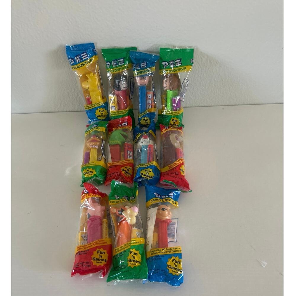 Vtg PEZ Candy Dispensers Unopened Disney Sesame St Peanuts Looney Tunes Lot/11